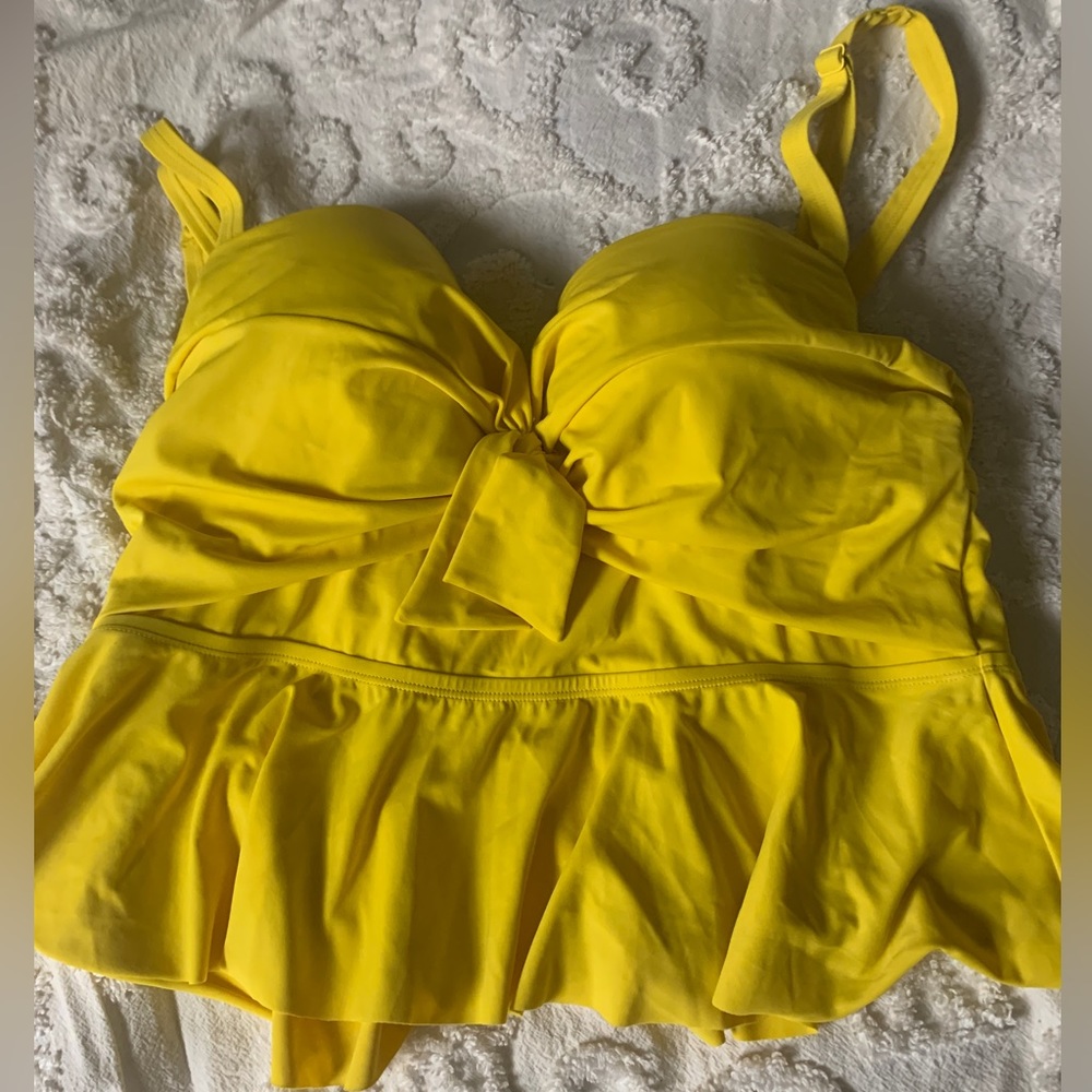 Torrid. Size 2 (18-20) yellow peplum swim top. Used